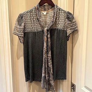 Flattering casual, top and size small with a scarf detail